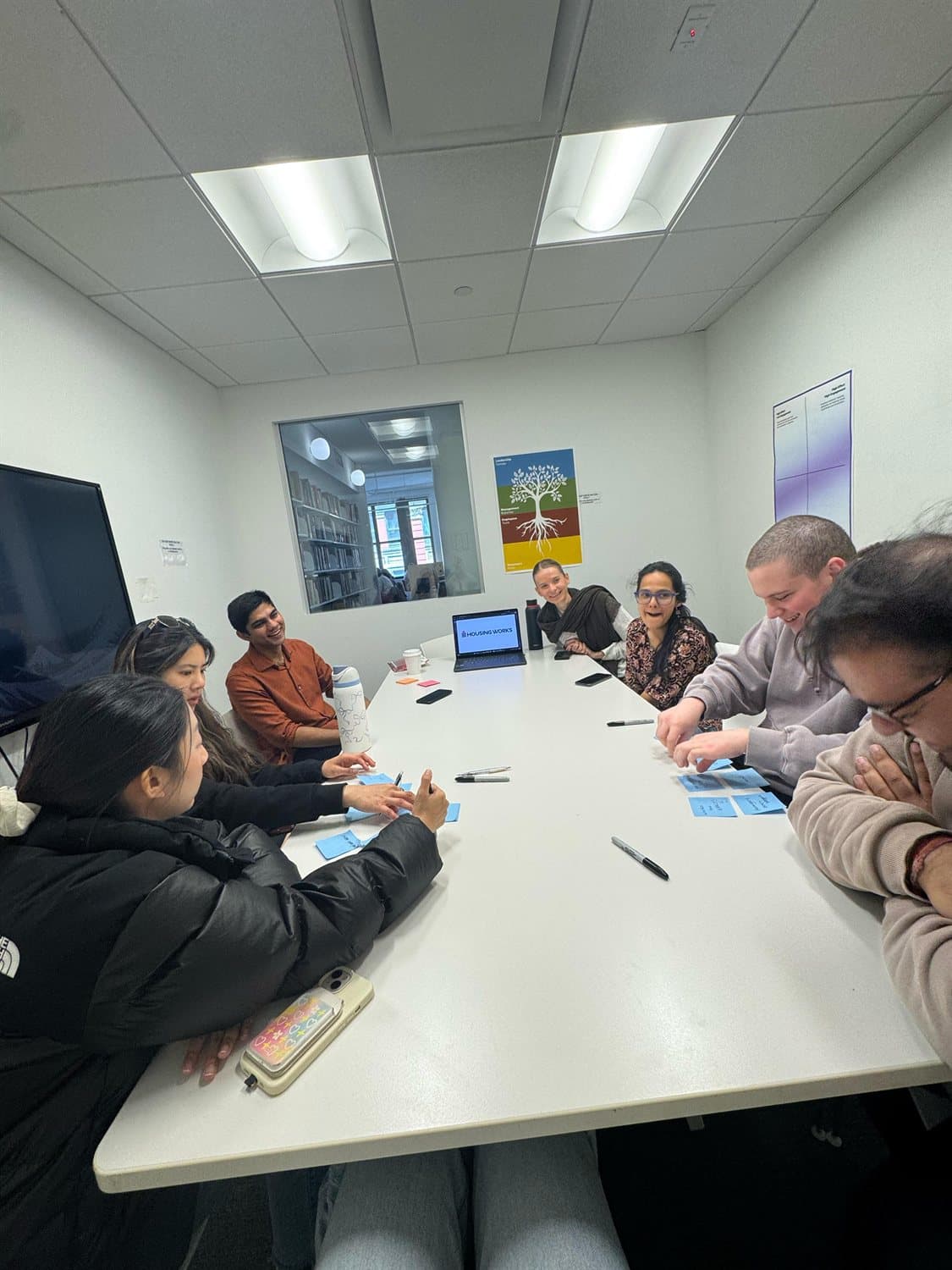 Participants working around the table.