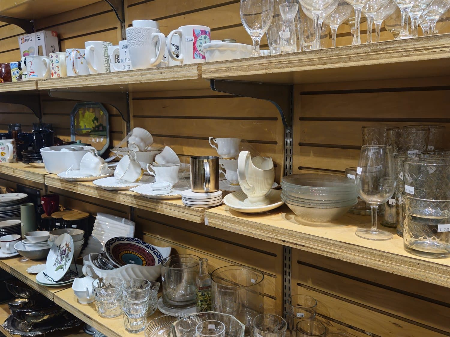 Housewares and glassware on the shelves.